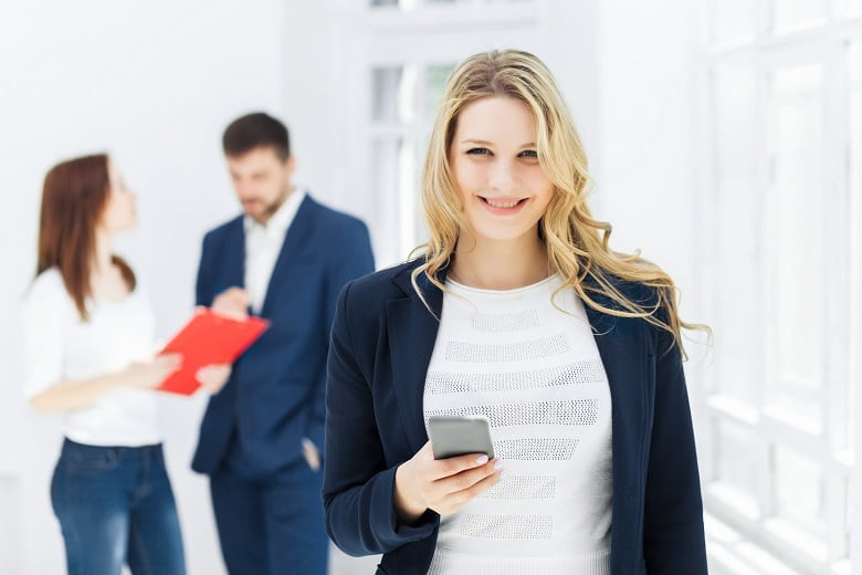 Portrait of businesswoman talking on phone in office
